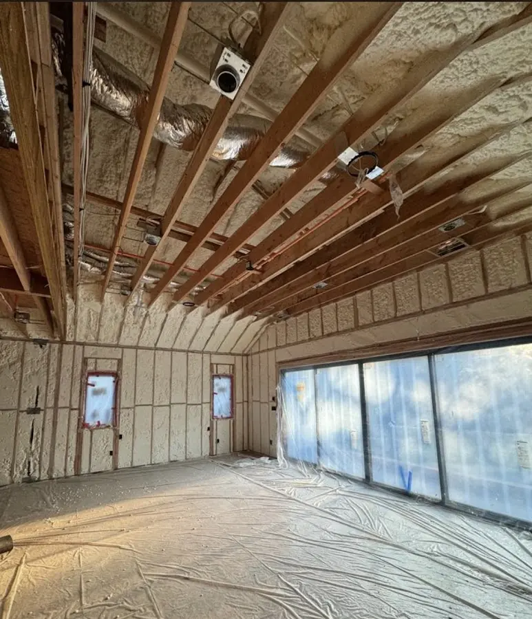 Interior walls and ceiling insulated with spray foam during new construction in Wauwatosa